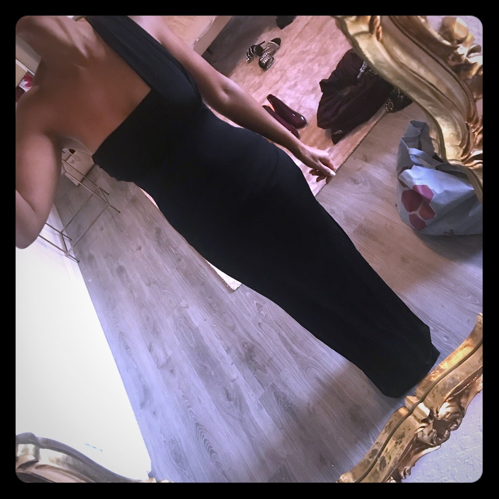 A fitted black gown with diamanté strap